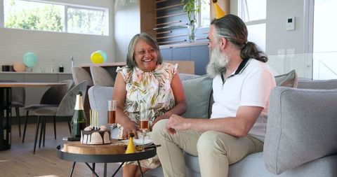 Senior Couple Enjoying Birthday Celebration at Home