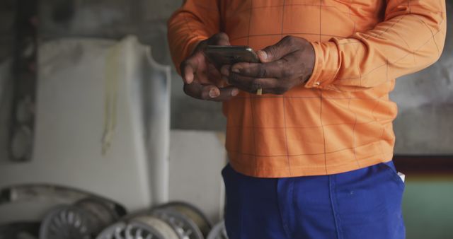 Mechanic Using Smartphone in Garage Workshop - Download Free Stock Images Pikwizard.com