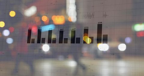 Digital Interface Displaying Financial Data Over City Lights