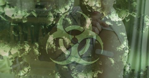 Senior woman receiving immunization with biohazard graphics