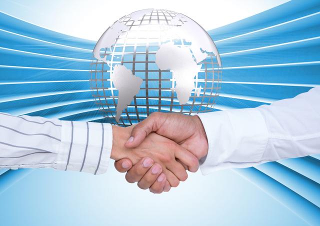Digital composition of business executives shaking hands against globe in background