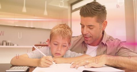 father and son enjoying learning together at home - Download Free Stock Images Pikwizard.com