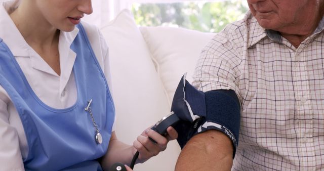 Nurse Measuring Blood Pressure of Elderly Patient at Home - Download Free Stock Images Pikwizard.com