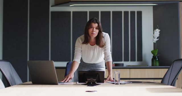 Serious Businesswoman in Conference Room Working on Laptop - Download Free Stock Images Pikwizard.com