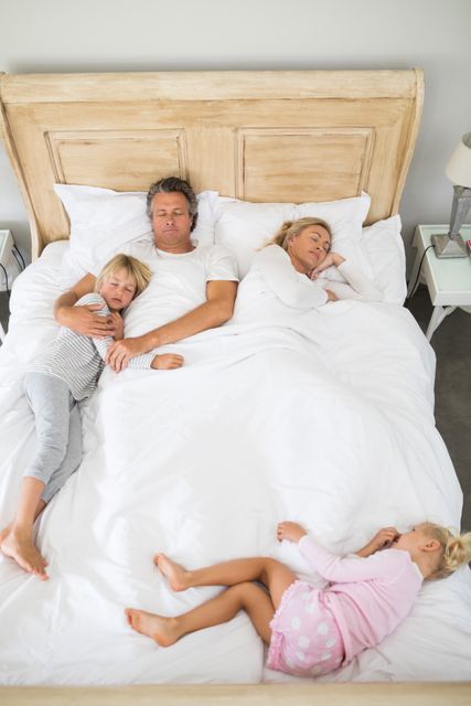 Peaceful Family Sleeping Together on Bed - Download Free Stock Photos Pikwizard.com