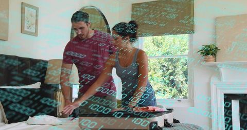 Couple packing suitcase in bright bedroom preparing for weekend getaway with luggage