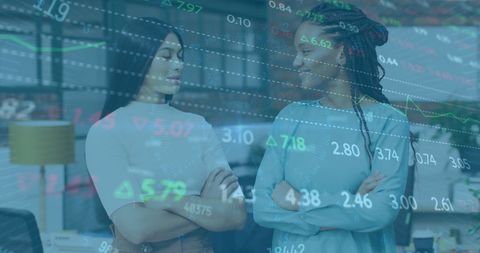 Diverse colleagues with digital financial overlay in modern office