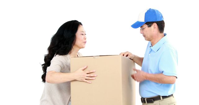 An Asian middle-aged woman receives a package from a delivery man, with copy space. Their interaction suggests a friendly and efficient delivery service.