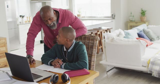 Father Helping Son with Homework in Modern Living Room - Download Free Stock Images Pikwizard.com