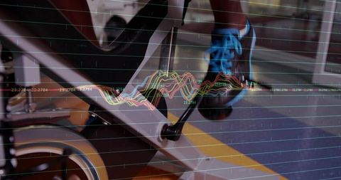 Pedaling indoor spin bike wearing blue-laced shoe with workout data overlay