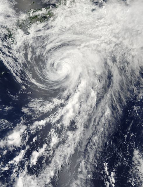 On Tuesday, June 11, 2013 Tropical Storm Yagi spun in the North Pacific Ocean just south of Japan. The Moderate Resolution Imaging Spectroradiometer (MODIS) aboard NASA’s Aqua satellite captured this beautiful true-color image of the storm on that same date at 4:10 UTC (1:10 p.m. Japan local time).  The image shows a clear apostrophe-shaped cyclone, with a closed eye and somewhat elliptical shape. The clouds associated with the northern fringes of the storm draped over southeastern coastal Japan, and a long “tail” (or band) of thunderstorms fed into the center from the south. Multispectral imagery also showed tight bands of thunderstorms wrapping into the center of the storm, although the building of thunderstorms was weakening around the center.  Near the same time as the image was captured, the Joint Typhoon Warning Center announced that vertical wind shear was starting to take a toll on Yagi. Northwesterly wind shear had caused the system to tilt slightly with the upper-level center displaced about 20 nautical miles east of the low-level center.  Tropical Storm Yagi developed from Tropical Depression 03W in the Western North Pacific Ocean on June 6, and intensified the weekend of June 8-9, when it reached Tropical Storm status and was given the name Yagi. Also known as Dante, the storm reached the maximum wind speeds on June 10 and 11, after which it began to weaken as it moved into cooler waters. On June 14, Yagi’s remnants passed about 200 miles south of Tokyo, and brought soaking rains to the coastline of Japan’s Honshu Island.  Credit: NASA/GSFC/Jeff Schmaltz/MODIS Land Rapid Response Team  <b><a href="http://www.nasa.gov/audience/formedia/features/MP_Photo_Guidelines.html" rel="nofollow">NASA image use policy.</a></b>  <b><a href="http://www.nasa.gov/centers/goddard/home/index.html" rel="nofollow">NASA Goddard Space Flight Center</a></b> enables NASA’s mission through four scientific endeavors: Earth Science, Heliophysics, Solar System Exploration, and Astrophysics. Goddard plays a leading role in NASA’s accomplishments by contributing compelling scientific knowledge to advance the Agency’s mission.  <b>Follow us on <a href="http://twitter.com/NASA_GoddardPix" rel="nofollow">Twitter</a></b>  <b>Like us on <a href="http://www.facebook.com/pages/Greenbelt-MD/NASA-Goddard/395013845897?ref=tsd" rel="nofollow">Facebook</a></b>  <b>Find us on <a href="http://instagram.com/nasagoddard?vm=grid" rel="nofollow">Instagram</a></b>