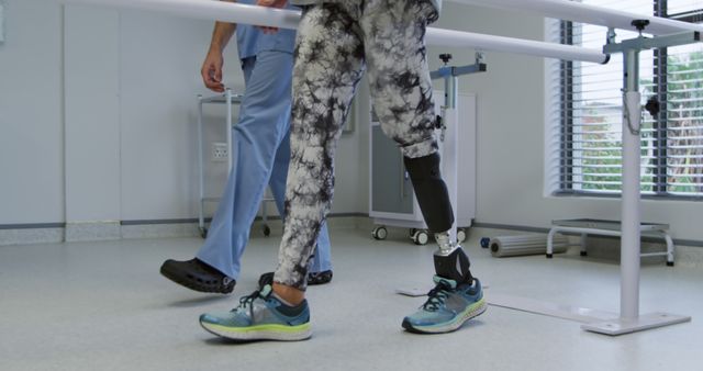 Person with Prosthetic Leg Practicing Walking with Therapist - Download Free Stock Images Pikwizard.com