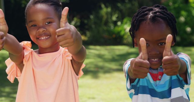 Happy Children Giving Thumbs Up Outdoors on Sunny Day - Download Free Stock Images Pikwizard.com