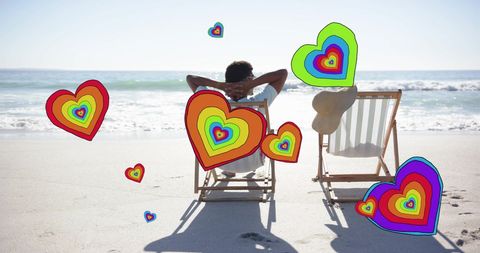 Couple Relaxing on Beach with Colorful Hearts Illustrating Love