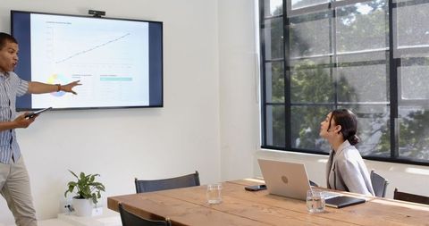 Professional Business Presentation in Modern Office Meeting