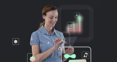 Woman tapping holographic interface on transparent tablet showing co2 bar graph for energy insights