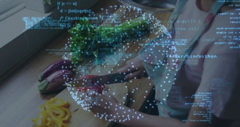 Home cook chopping red onion with knife on wooden board with herbs under digital data overlay