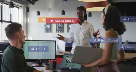 Collaborating team reviewing social media analytics dashboard with subscribed and liked notification