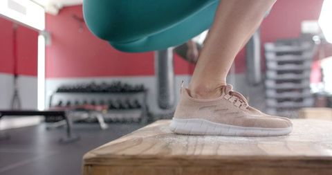 Athletic Legs Performing Intense Box Jumping Workout