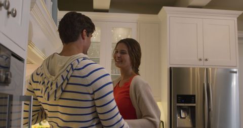 Happy Couple Dancing Together in Modern Kitchen