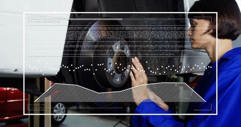 Female Mechanic Inspecting Brake Rotor and Hub on Lift with Augmented Diagnostics Overlay