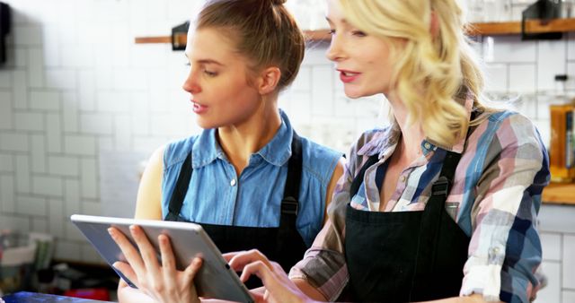 Baristas Using Digital Tablet in Modern Coffee Shop - Download Free Stock Images Pikwizard.com