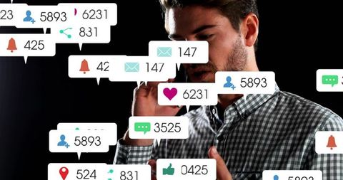 Man managing overwhelming social media notifications while talking on phone and gesturing