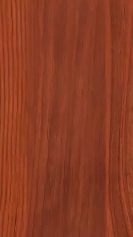 Vertical panning over warm wood plank revealing knot and rich grain texture, close-up