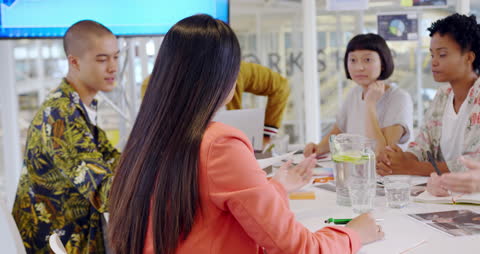 Diverse Creative Group Collaborating in Open Plan Office