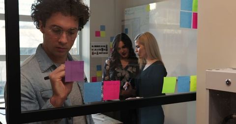 Creative team collaborating and brainstorming ideas in office