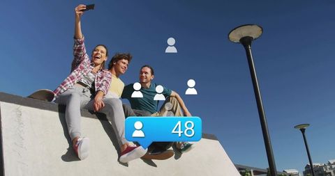 Friends taking selfie on urban skate ramp with social followers notification 48 skateboard