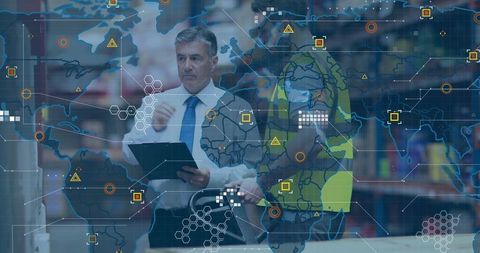 Warehouse manager pointing at tablet reviewing logistics analytics dashboard overlay