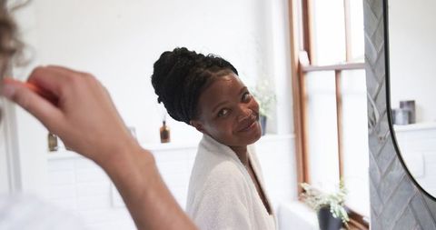 Morning Routine for Diverse Couple Maintaining Dental Hygiene Together