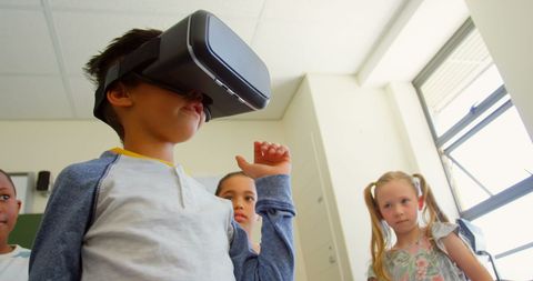Young Student Experiencing Virtual Reality in Classroom