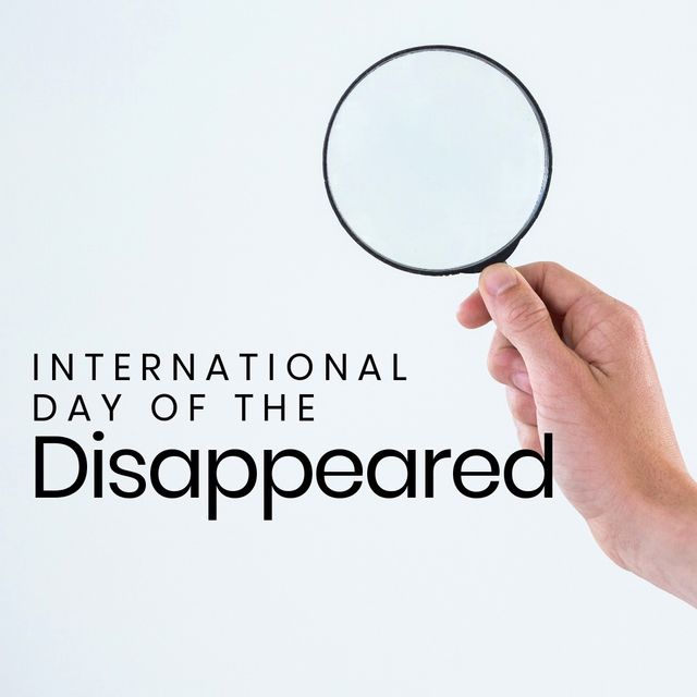 Composite of hand of caucasian man holding magnifying glass and international day of the disappeared. White background, copy space, searching, imprison, missing, kidnapped, awareness and alertness.