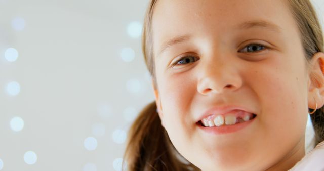 Joyful Girl Smiling in Soft Light with Out of Focus Background - Download Free Stock Images Pikwizard.com