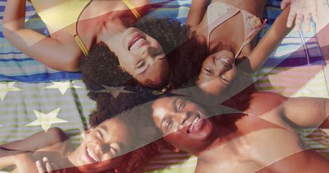 Family Bonding at Beach Overlaid with American Flag