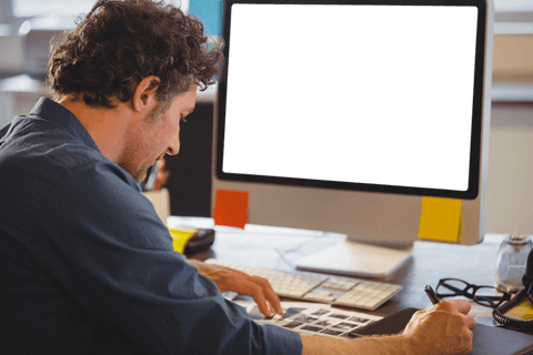 transparent computer screen with curly-haired man at desk - Download Free Stock Videos Pikwizard.com