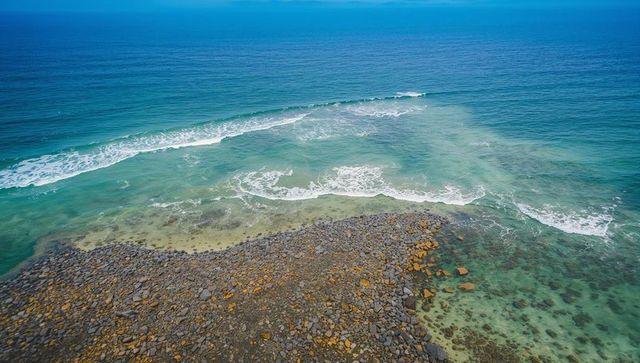 Rocky coastline with turquoise waters and calm waves