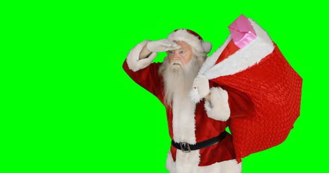 Santa Claus Holding Sack of Presents, Searching, Green Background - Download Free Stock Images Pikwizard.com