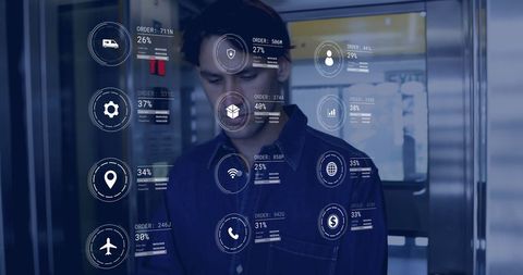 caucasian worker analyzing data interfaces in warehouse - Download Free Stock Images Pikwizard.com