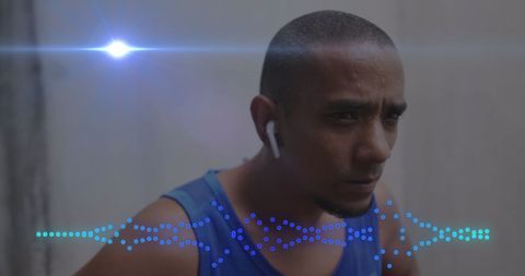 Focused athlete with audio visualization and earphones