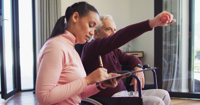 Young caregiver assisting elderly man during rehabilitation session - Download Free Stock Images Pikwizard.com