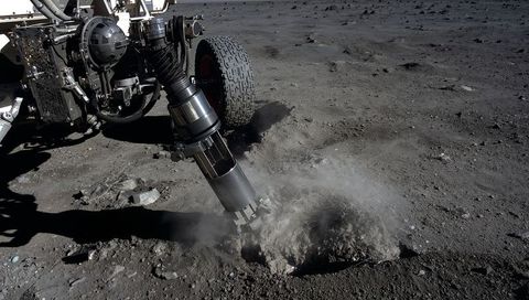 Robotic drill sampling lunar regolith beside rover wheel, dust plume rising on moon plain