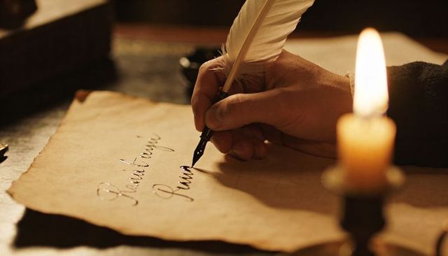 Candlelit quill calligraphy on aged parchment handwriting manuscript in warm light