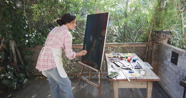 Artist Painting Outdoors Surrounded by Greenery - Download Free Stock Images Pikwizard.com