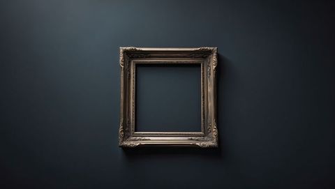 Ornate woods carved frame on minimalist gallery wall