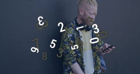 Casual Man Engaged with Digital Floating Numbers Outdoors