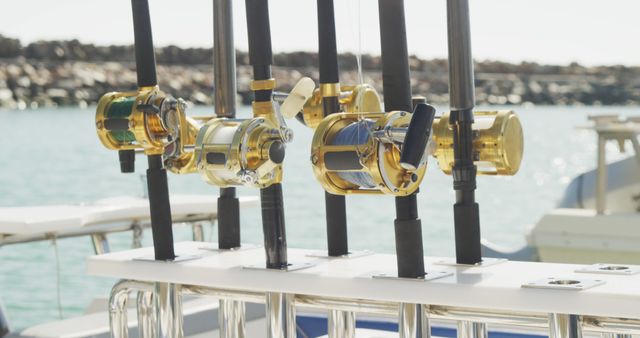 A selection of fishing rods onboard fishing boat moored in harbour. Leisure, hobbies, travel, water transport and vacations.