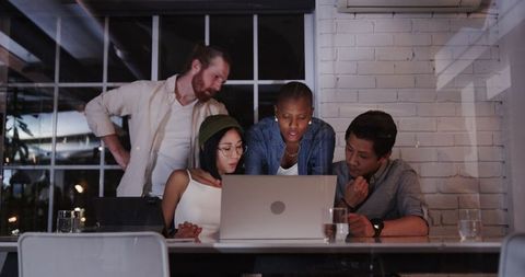 Diverse Team Collaborating in Office on Modern Technology
